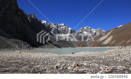 Blue sky over Thonak Tsho, lake in the upper Gokyo Valley, Nepal. 126388948