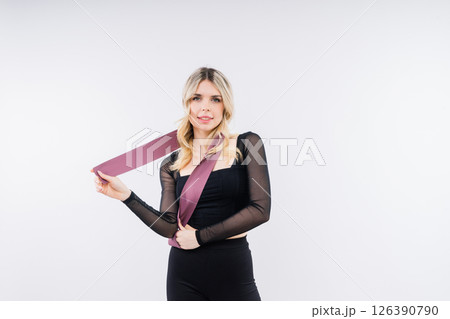 Photo of woman workout with resistance band. Strength and motivation. Photo of woman workout with resistance band. Strength and motivation. 126390790