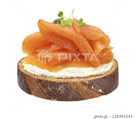 Smoked salmon with cream cheese on rye bread slice isolated on white background with clipping path, package design element Smoked salmon with cream cheese on rye bread slice isolated on white background with clipping path, package design element 126391543