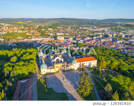 Holy Mountain in Pribram is a stunning Baroque pilgrimage site surrounded by lush greenery and offering panoramic views of the nearby town and hills. Visitors come for reflection and tranquility. 126391910