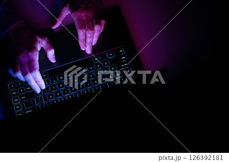Male hands are typing on a laptop keyboard. 126392181