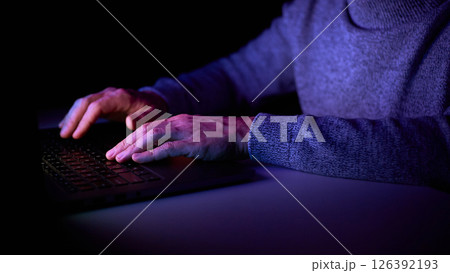 Male hands are typing on a laptop keyboard. 126392193