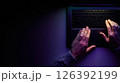 Male hands are typing on a laptop keyboard. 126392199