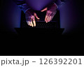 Male hands are typing on a laptop keyboard. 126392201