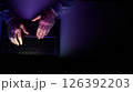 Male hands are typing on a laptop keyboard. 126392203