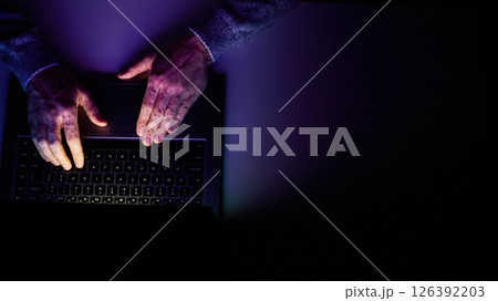 Male hands are typing on a laptop keyboard. Male hands are typing on a laptop keyboard. 126392203