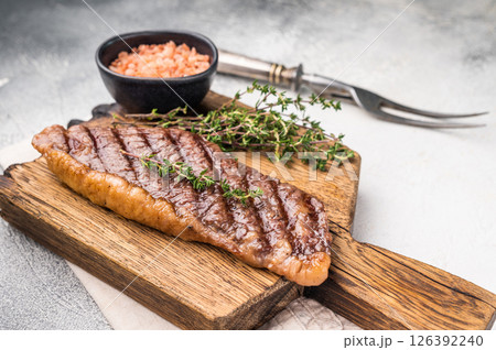Grilled Top Sirloin, cooked rump beef steak. grey background. top view 126392240