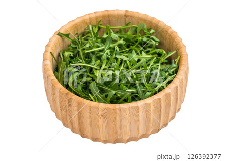 Fresh arugula leaves, vibrant and peppery, perfect for adding a zesty touch to salads and sandwiches. isolated on white background. top view 126392377