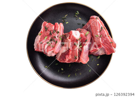 Raw mutton cut rib chops, fresh lamb meat with herbs for grilling isolated on white background. top view Raw mutton cut rib chops, fresh lamb meat with herbs for grilling isolated on white background. top view 126392394