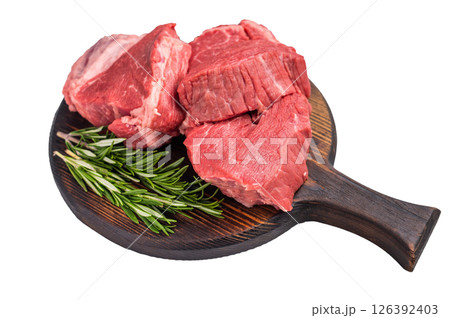 Raw beef fillet tender steaks on a decorative wooden board, fresh meat ready for grill. isolated on white background. top view 126392403