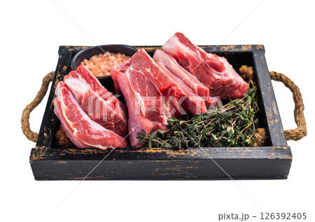 Fresh Raw lamb rib cuts, mutton meat with rib bone in wooden board isolated on white background. top view Fresh Raw lamb rib cuts, mutton meat with rib bone in wooden board isolated on white background. top view 126392405