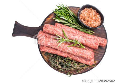 Balkan raw Cevapcici Sausage, fresh Cevapi from mince beef and pork meat isolated on white background. top view Balkan raw Cevapcici Sausage, fresh Cevapi from mince beef and pork meat isolated on white background. top view 126392502