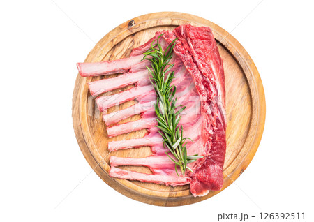 Uncooked rack of lamb, raw mutton chops on wooden board isolated on white background. top view 126392511