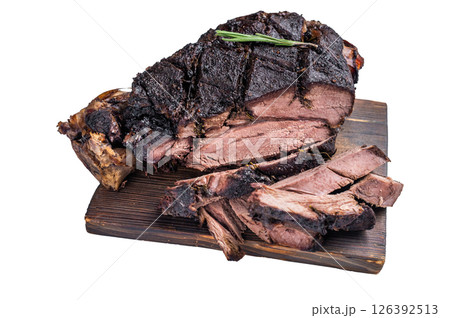 Slow ccoked sliced Venison leg, roasted game meat of deer on a board with herbs isolated on white background. top view 126392513