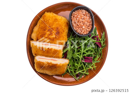 Chicken Fried cordon bleu cutlet on plate with salad isolated on white background. top view 126392515