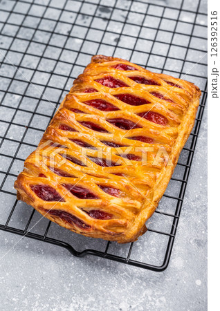 Danish pastry with a strawberry and cream cheese filling. grey background. top view 126392516