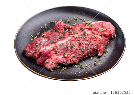 Raw hanger tender beef steak, skirt steak on plate with herbs and spices isolated on white background. top view Raw hanger tender beef steak, skirt steak on plate with herbs and spices isolated on white background. top view 126392523