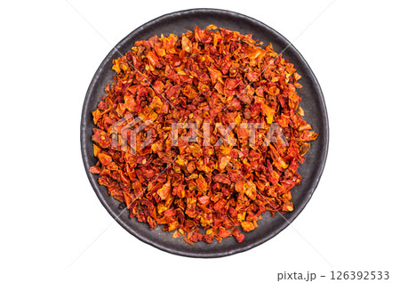 Sun Dried Tomato Flakes Isolated on White background. top view Sun Dried Tomato Flakes Isolated on White background. top view 126392533