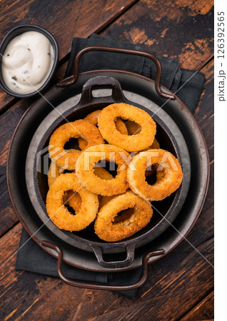 Crispy Fried squid rings, calamari fastfood snack. wooden background. top view 126392565