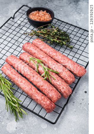 Raw beef and lamb meat kebabs sausages, kofta kebab. grey background. top view 126392625