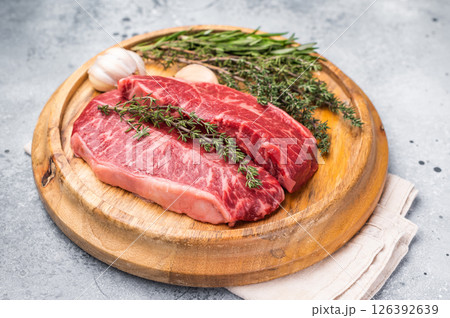 Raw beef marbled steak, Australian Oyster Top blade steak. grey background. top view Raw beef marbled steak, Australian Oyster Top blade steak. grey background. top view 126392639