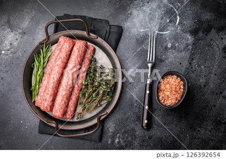 Fresh minced beef and lamb kebabs with fresh spices, arabic kofta kofte kebab. black background. top view 126392654