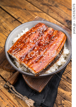 Unagi don or Japanese grilled eel rice in a bowl. wooden background. top view 126392678