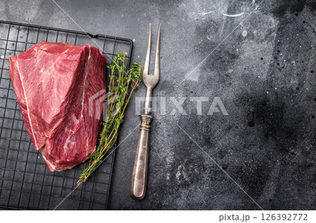 Raw Roe Deer meat, Wild Venison Game Meat. black background. top view Raw Roe Deer meat, Wild Venison Game Meat. black background. top view 126392772