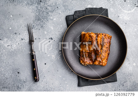 Roasted Teriyaki salmon fillet with salad. black background. top view 126392779