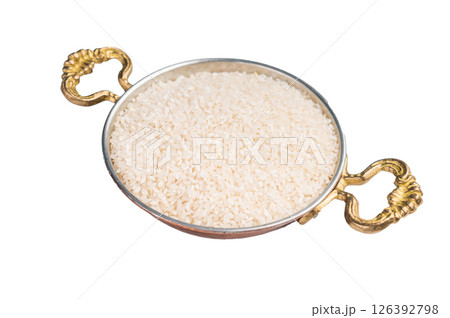 Uncooked white Rice in a bowl isolated on white background. top view Uncooked white Rice in a bowl isolated on white background. top view 126392798
