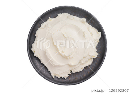 Creamy Homemade Mascarpone cheese, cream cheese isolated on white background. top view Creamy Homemade Mascarpone cheese, cream cheese isolated on white background. top view 126392807