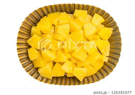 Pineapple chunks slices in a plate isolated on white background. top view 126392877