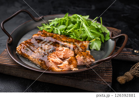 Roasted Teriyaki salmon fillet with salad. black background. top view 126392881