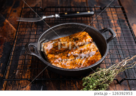 Teriyaki salmon fish fillet with glaze in a skillet. wooden background. top view 126392953