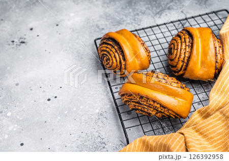 Baked Poppy Seed Rolls. grey background. top view 126392958