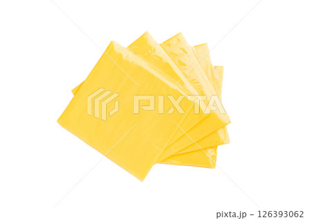 Square Slices of processed Cheddar cheese in individual plastic packaging isolated on white background Square Slices of processed Cheddar cheese in individual plastic packaging isolated on white background 126393062