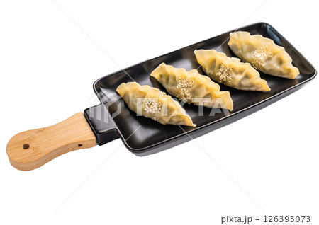 Steamed Chinese Jiaozi Dumplings with pork meat and vegetables isolated on white background. top view Steamed Chinese Jiaozi Dumplings with pork meat and vegetables isolated on white background. top view 126393073
