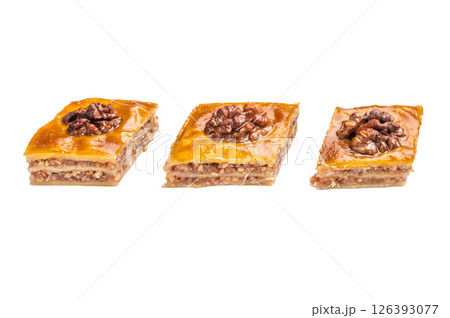 Traditional Honey Walnut Baklava isolated on white background. top view Traditional Honey Walnut Baklava isolated on white background. top view 126393077