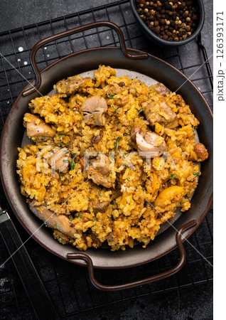 Arabic national rice food pilaf or plov, cooked with fried lamb and beef meat. black background. top view 126393171