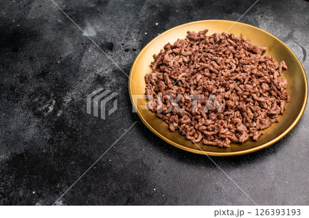 Roast and Fried mince meat, fresh cooked ground meat in a plate. black background. top view 126393193