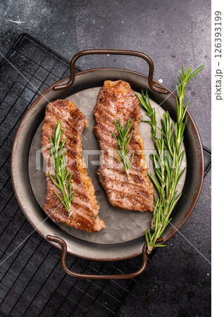 BBQ roast marbled beef Steak, beef meat on tray with herbs. black background. top view 126393199
