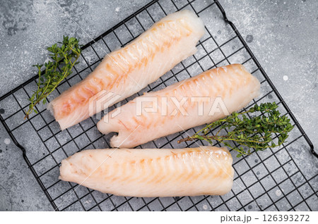Fresh raw cod fish fillet, Boneless white fish meat. gray background. top view 126393272