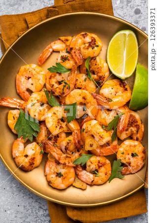 BBQ dinner with roast Shrimps Prawns in a plate. Gray background. Top view 126393371