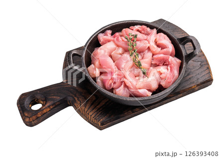 Raw Chicken sliced thighs fillets in a skillet isolated on white background Raw Chicken sliced thighs fillets in a skillet isolated on white background 126393408