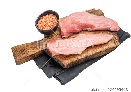 Raw pork fillet steaks, loin chops on a wooden board isolated on white background. top view 126393448