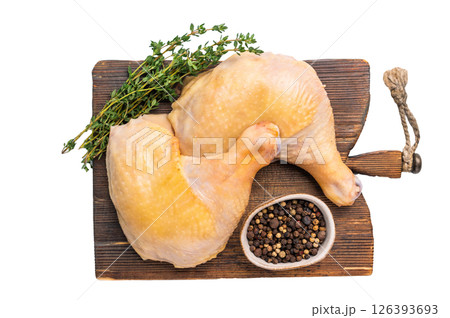 Raw chicken leg on cutting board, farm poultry meat isolated on white background Raw chicken leg on cutting board, farm poultry meat isolated on white background 126393693