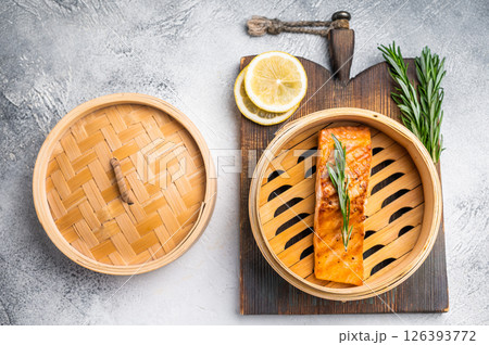 Cooked salmon fillet steak with rosemary, red sea fish. white background. top view Cooked salmon fillet steak with rosemary, red sea fish. white background. top view 126393772