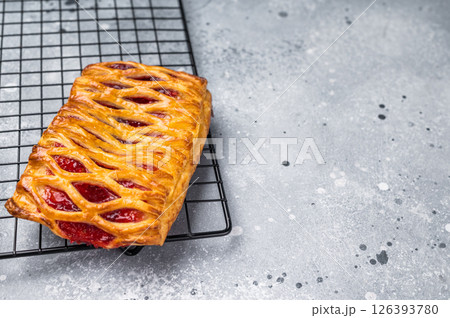 Danish pastry with a strawberry and cream cheese filling. grey background. top view 126393780