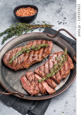 Roast Top blade steak, grilled beef shoulder meat. grey background. top view Roast Top blade steak, grilled beef shoulder meat. grey background. top view 126393822
