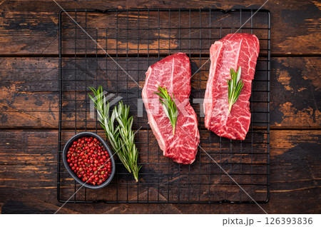 Raw Top blade steak, marbled black angus prime beef. wooden background. top view Raw Top blade steak, marbled black angus prime beef. wooden background. top view 126393836